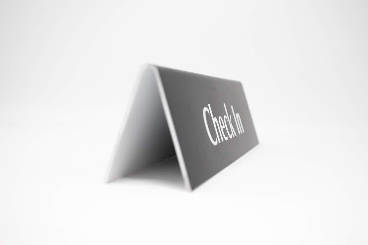 Check In Sign | Reception Desk & Lobby Counter Signs | Waiting Room Signage | Laser Engraved & Double Sided | 9” x 2” Black Acrylic | Made In USA