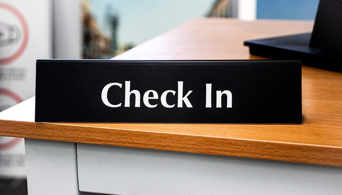 Check In Sign | Reception Desk & Lobby Counter Signs | Waiting Room Signage | Laser Engraved & Double Sided | 9” x 2” Black Acrylic | Made In USA
