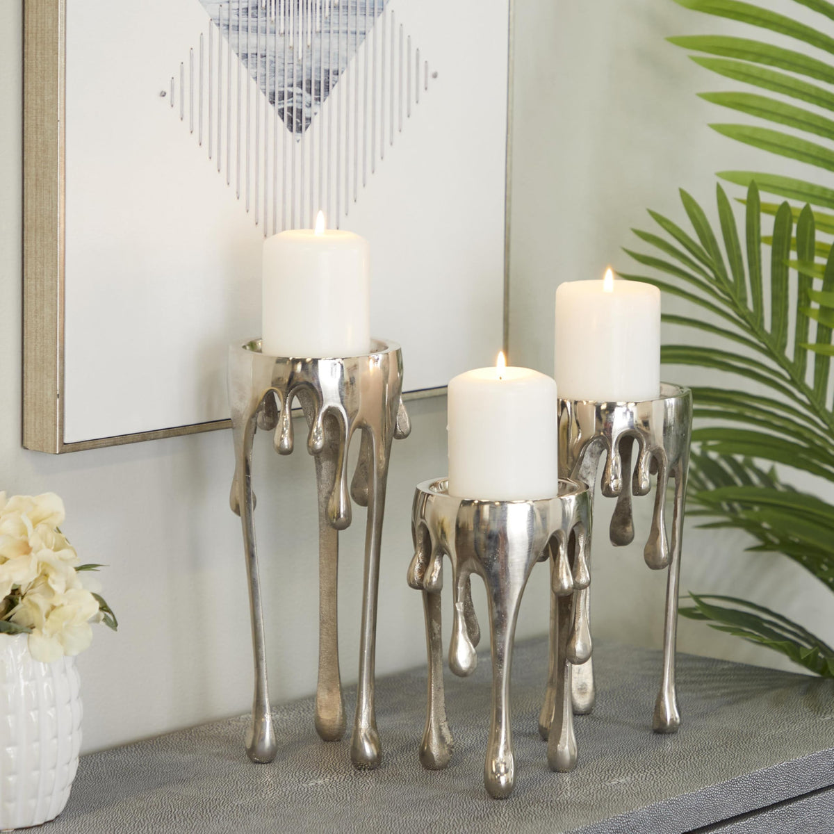 CosmoLiving by Cosmopolitan Aluminum Metal Abstract Decorative Candle Holder Melting Drip Candle Stand, Set of 3 Candlestick Holder 12", 10", 8"H, Silver