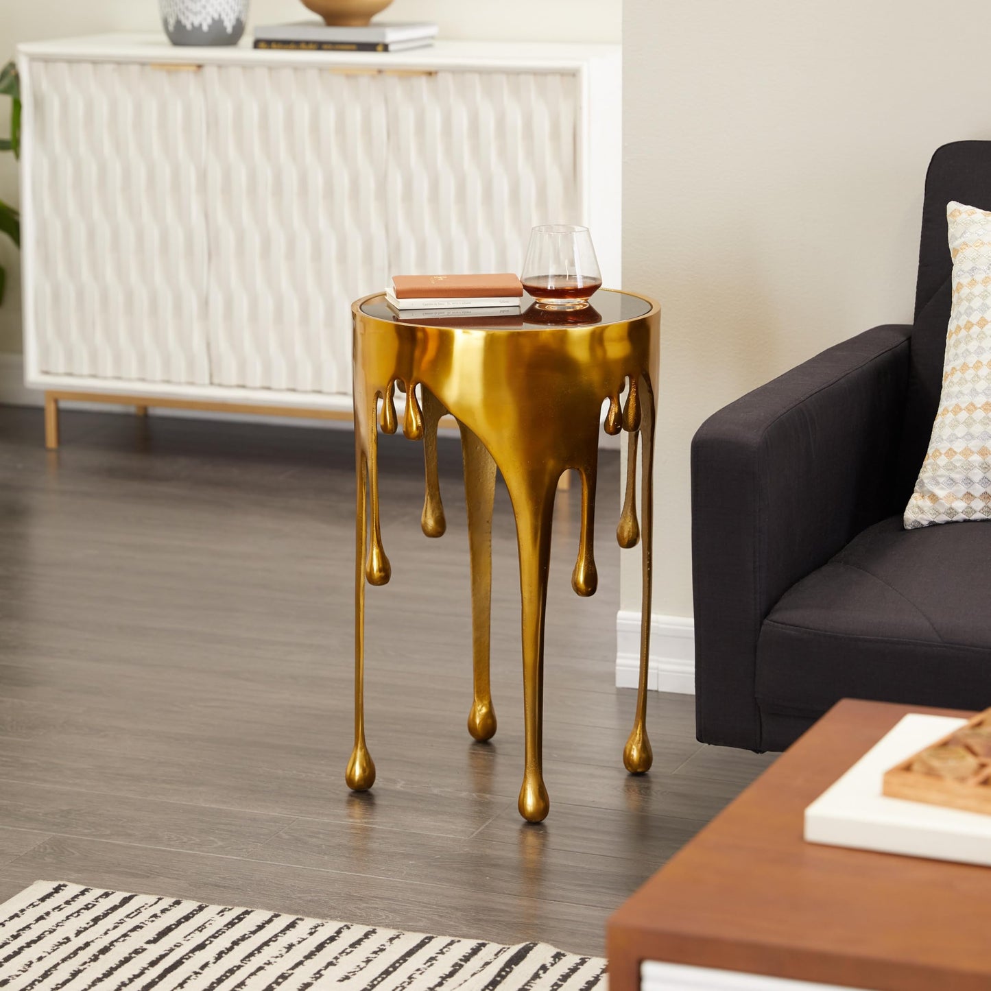Deco 79 Aluminum Metal Abstract Melting Drip Accent Table with Melting Design and Shaded Glass Top, 16' x 16' x 25', Gold
