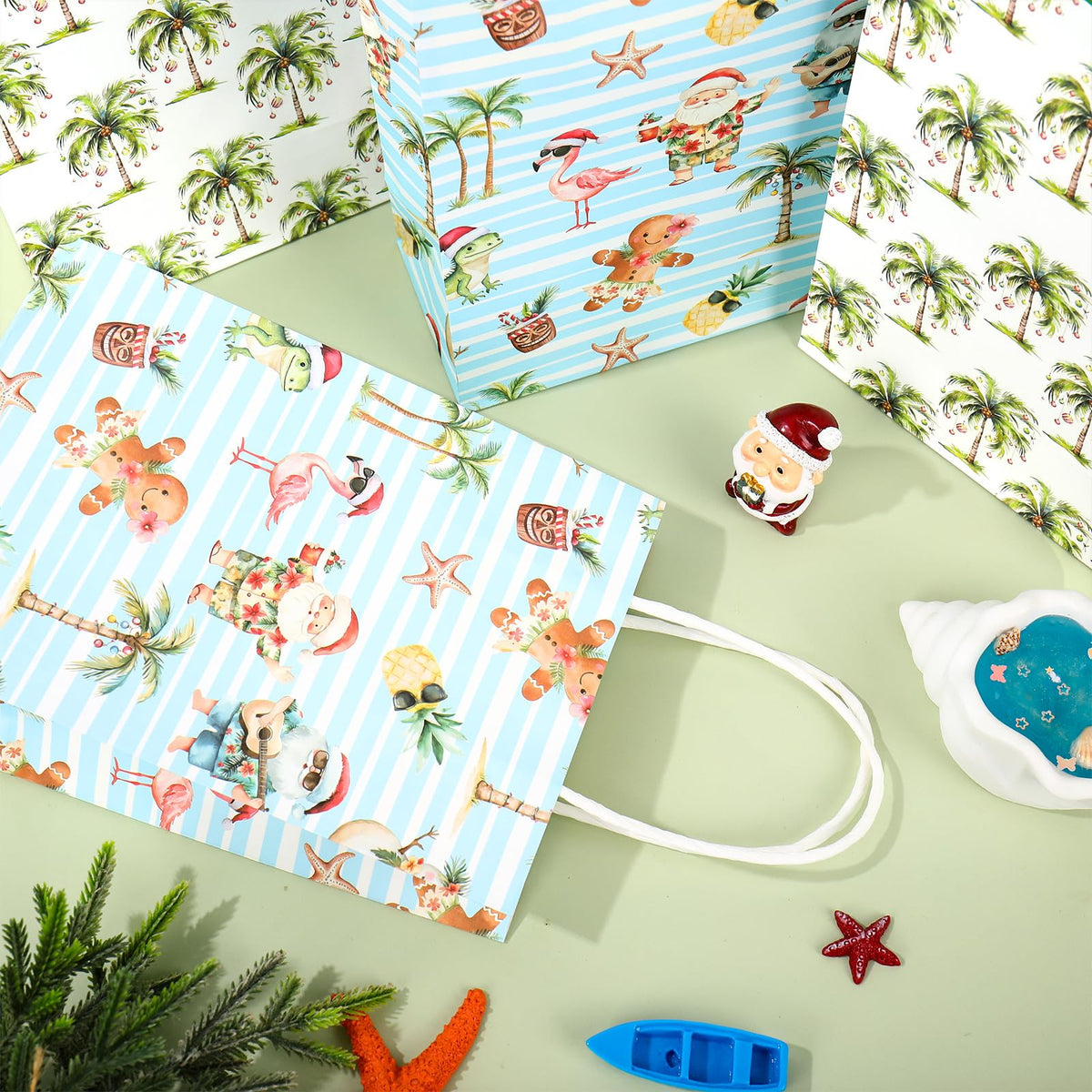 JarThenaAMCS 16 Pcs Summer Christmas Paper Gift Bag Watercolor Xmas in July Coconut Tree Santa Claus Treat Bags with Handles Tissue Paper Tropical Candy Goodie Bags for Holiday Party Favors Supplies