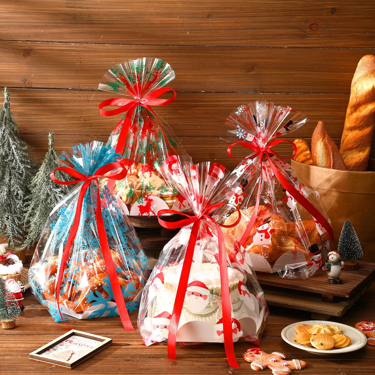 Sunnychicc 24 Pack Christmas Clear Plastic Bake Bags with 8'' Cake Tray Red Ribbon Bakery Gift Packaging Santa Snowman Elk Snowflake Pattern Cellophane Treat Bags for Toast Bread Cookies Candy Food